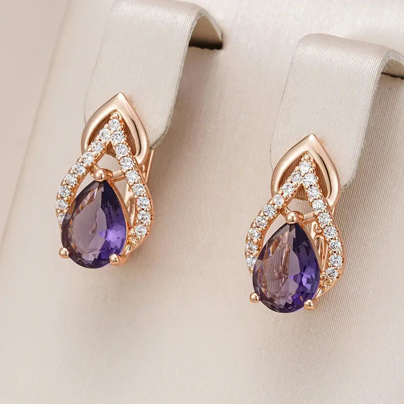 Elegant purple crystal drop earrings in golden