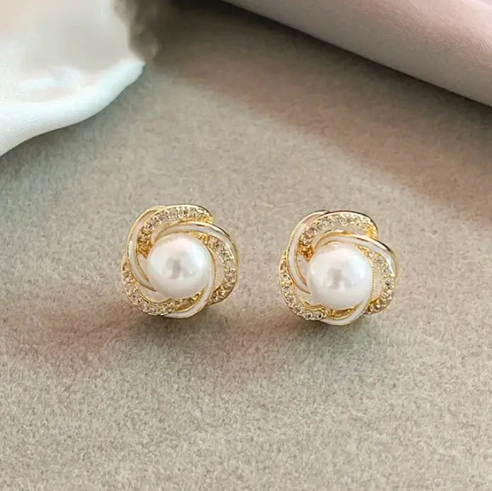 Elegant golden zirconia spiral pearl earrings