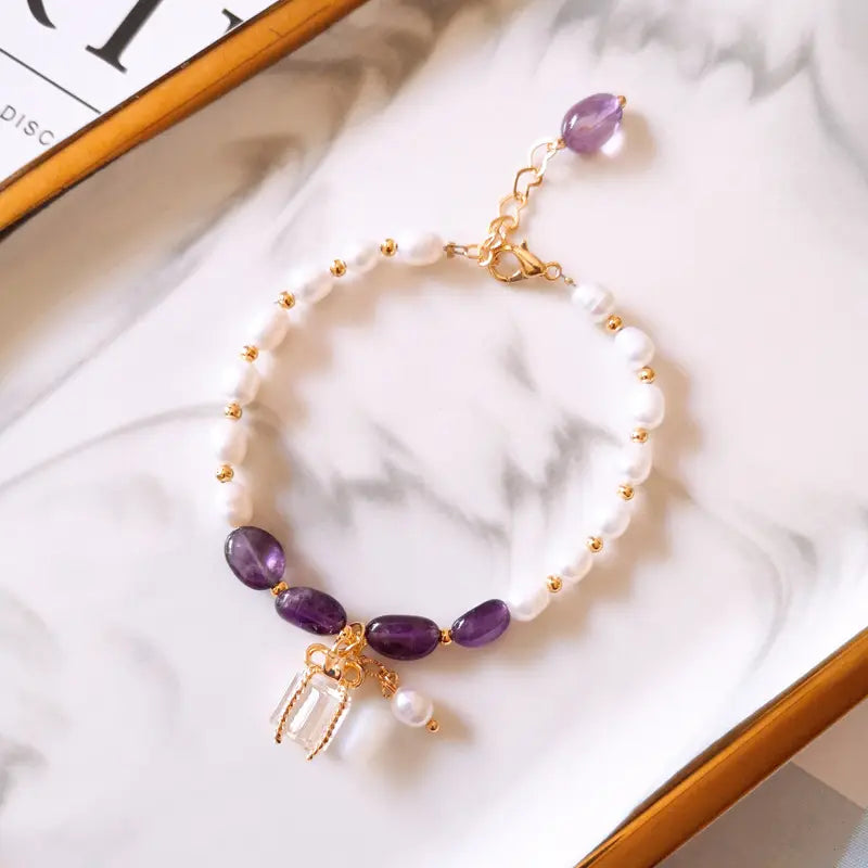 Bracelet with purple stones and pearls in golden